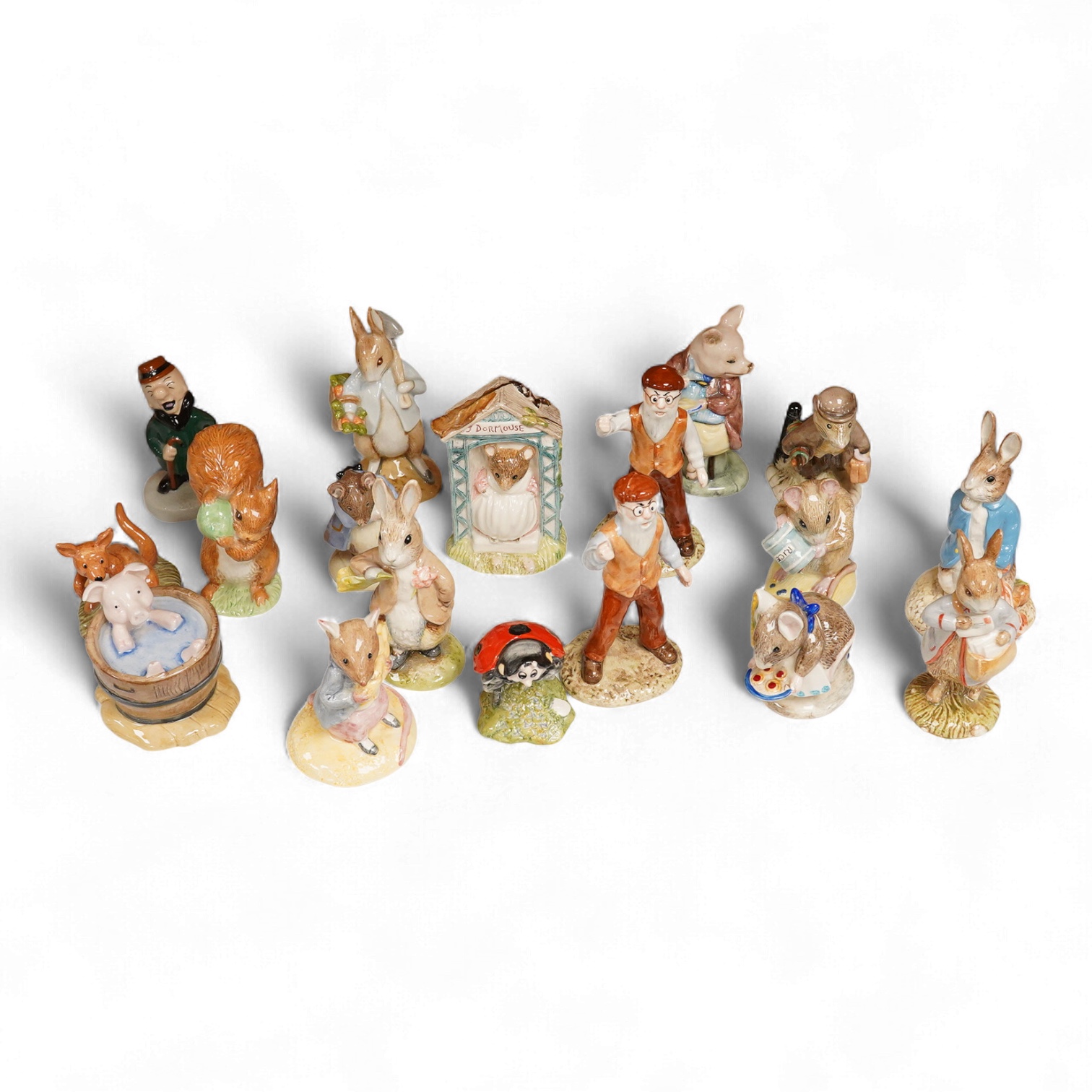 A collection of eighteen mixed Royal Doulton and Royal Albert figures of Beatrix Potter characters, largest 13cm high